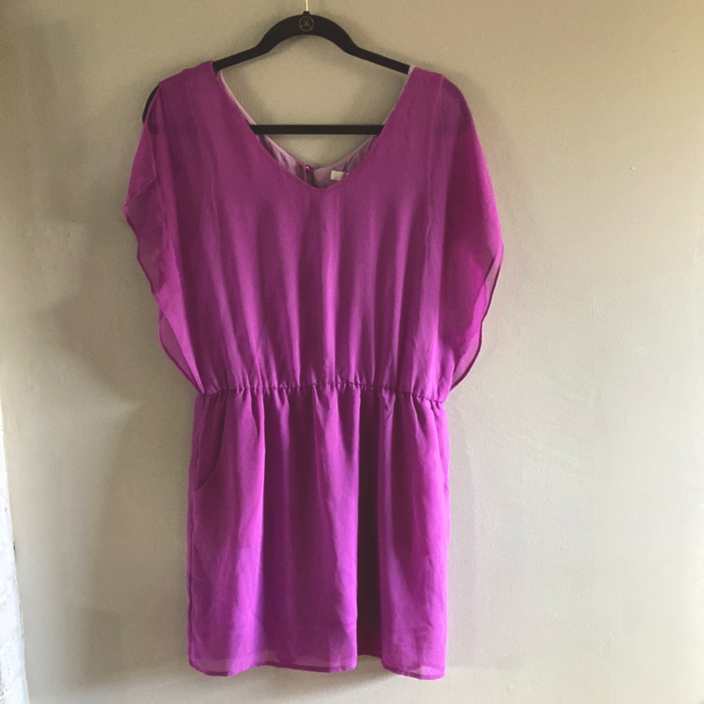 Flutter sleeve purple dress with pockets and open back detail